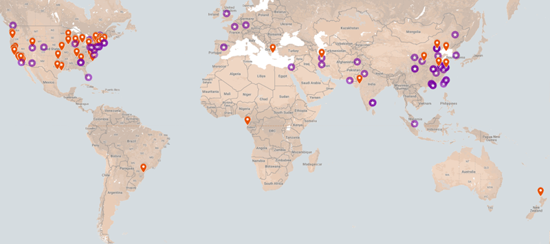 map of the world with red and purple pins dropped in student's countries of origin